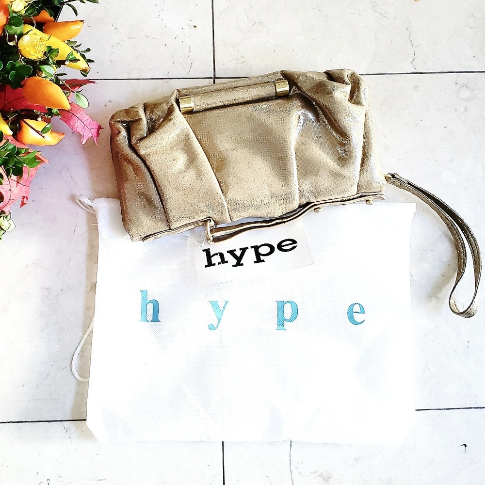 Hype shimmery gold wristlet